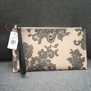 Never used Michael kors LG oyster clutch